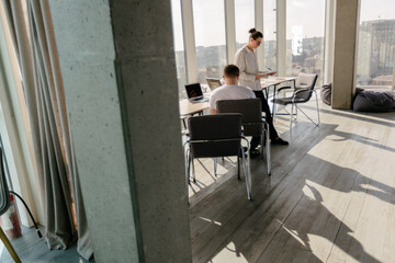 Two office workers working together 