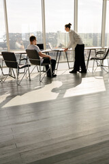 Two office workers working together 