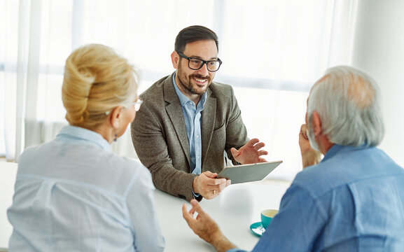 meeting agreement investment couple contract advice retirement consultation house finance senior elderly insurance senior couple office