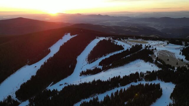 Aerial drone morning view of ski resort Rogla at sunrise dawn. Panoramic winter shot of Ski center Rogla, Slovenia