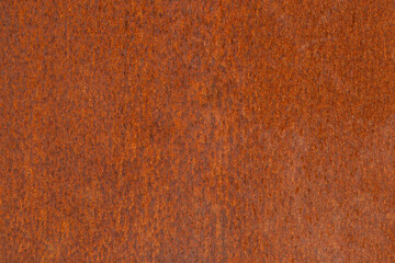 Rusted metal texture for background. Damaged old iron gate. Vintage style, orange steel.