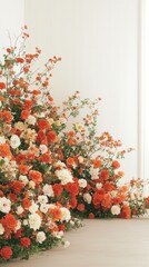 Fototapeta premium Lush floral display of orange and white roses and blooms with artistic arrangement for event decoration