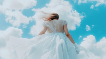 Woman in white dress, skyward view, clouds