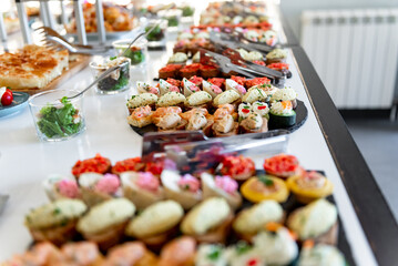 Delicious array of colorful canapes displayed elegantly at a festive buffet for a special gathering