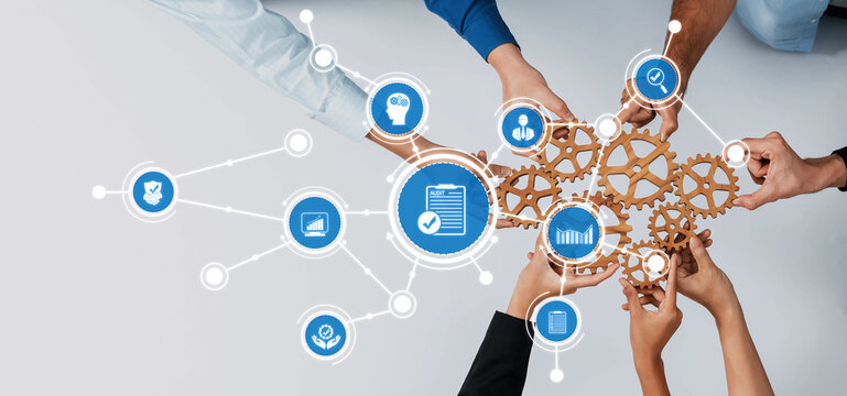Hands working together to connect gears and digital icons symbolize teamwork and strategy in modern business environments, highlighting collaboration and planning for success. Amity