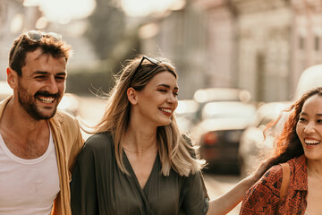 Young friends soaking up the sun while exploring the streets. Golden house glow