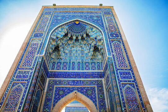 Beautiful Gur-e-Amir Mausoleum in Samarkand, Uzbekistan. Exterior view on sunny day. Guri Amir. With "Allah is great" in arabic.