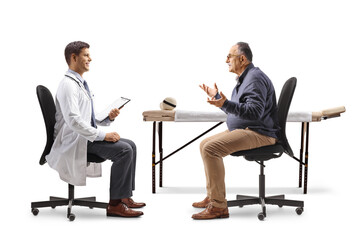 Mature male patient sitting in a chair and talking to a male doctor