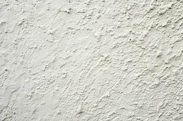 Fototapeta premium Close-Up Texture of a Rough White Plaster Wall with Subtle Patterns and Depth for Architectural or Interior Design Projects