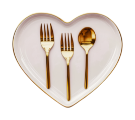 Heart-shaped plate with gold cutlery: forks and spoon arrangement, cut out
