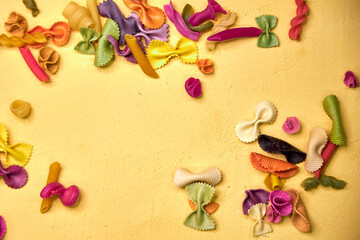 bright yellow background with colorful macaroni