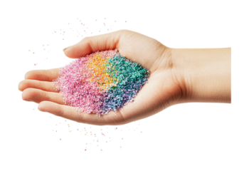 Child's hand holding colorful glitter mix, cut out