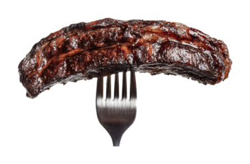 Grilled bbq rib on fork with shiny glaze, cut out