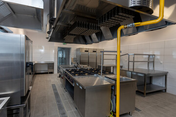 A Modern Commercial Kitchen meticulously equipped with Stainless Steel Equipment and features