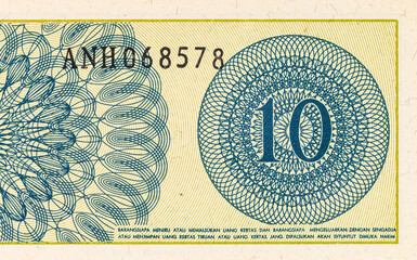 Fragment of a 10 sen banknote of Indonesia, 1964. Indonesian money. © Sergii
