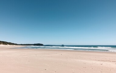 Obraz premium Tranquil Beach Scene Under a Clear Blue Sky
