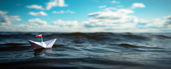 Small paper boat in big waves - Panorama