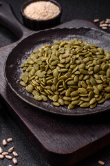 Peeled pumpkin seeds in a bowl, an ingredient for making vegetarian food
