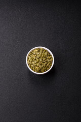 Peeled pumpkin seeds in a bowl, an ingredient for making vegetarian food