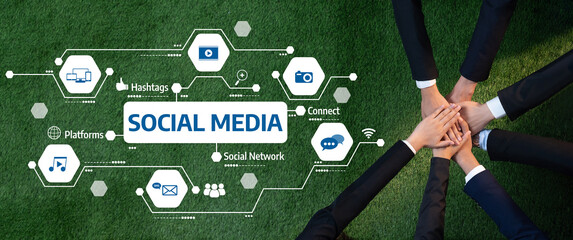 This image illustrates hands coming together on green grass, symbolizing unity and connection, enhanced by social media icons representing digital engagement and community. Amity