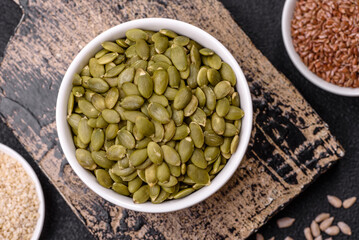Peeled pumpkin seeds in a bowl, an ingredient for making vegetarian food