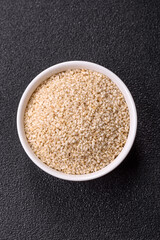 White sesame seeds in a bowl, an ingredient for making vegetarian food
