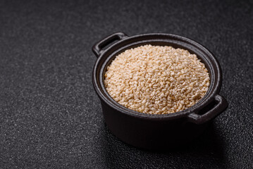White sesame seeds in a bowl, an ingredient for making vegetarian food