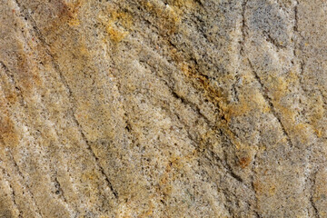 Close-up of natural stone patterns, showcasing unique textures, cracks, and organic formations. Ideal for background and texture
