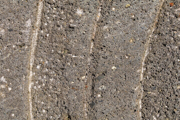 Close-up of natural stone patterns, showcasing unique textures, cracks, and organic formations. Ideal for background and texture