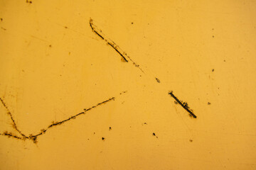 Close-up of rusted metal and weathered paint, featuring corrosion, peeling layers, and rough textures, perfect for background and texture