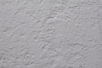 Close-up of light grey painted metal, highlighting surface textures with subtle variations in tone. Ideal for background and texture