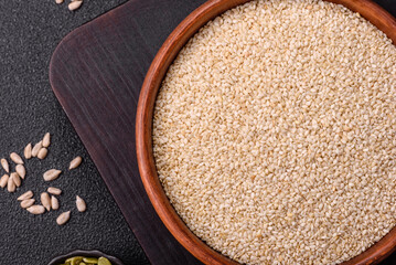 White sesame seeds in a bowl, an ingredient for making vegetarian food