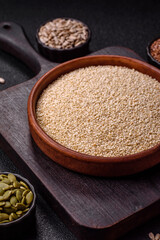 White sesame seeds in a bowl, an ingredient for making vegetarian food