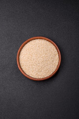 White sesame seeds in a bowl, an ingredient for making vegetarian food