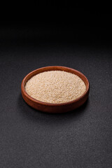White sesame seeds in a bowl, an ingredient for making vegetarian food