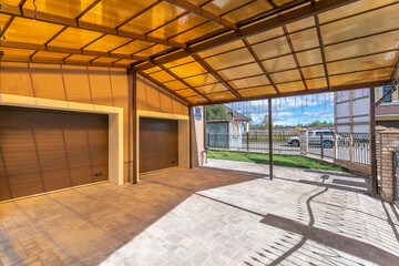 Spacious Parking area for cars on private territory. Large polycarbonate canopy. .Automatic garage...