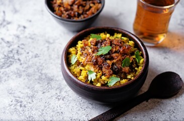 Fried onion lentil fried rice in a bowl, moujadara