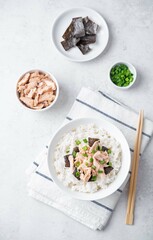 Rice bowl with salmon flakes, nori and scallion