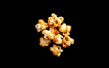 Golden Caramel Popcorn on Black Background