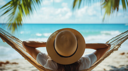 a woman lying in a hammock on the beach