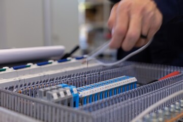 assembly of electrical cabinet components, installation of components in production, hands on site main plan