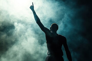 Silhouette of a basketball player celebrating with arms raised and a finger pointed in the air, against a dark background with smoke and fog Generative AI