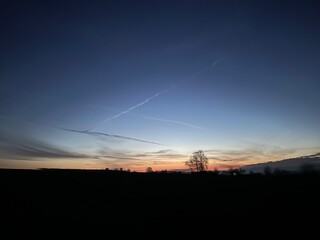 Plane lines at sunrise