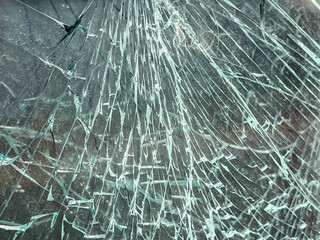 A broken car window that hasn't fallen apart yet, as a background