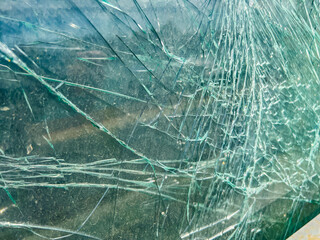 A broken car window that hasn't fallen apart yet, as a background