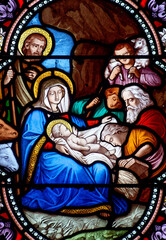 Stained glass (19th century) of Christmas Nativity Scene with Virgin Mary, Saint Joseph, and Jesus baby.