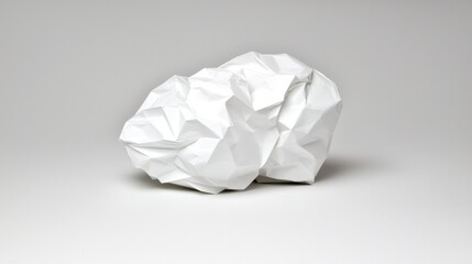 A crumpled piece of white paper.