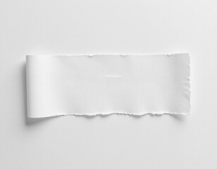 Naklejka premium Ripped White Paper Strip on White Background for Creative Use