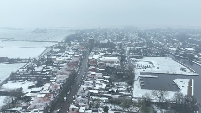Aerial from the snowy traditional town Workum in Friesland the Netherlands in winter