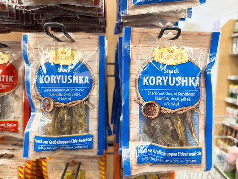 Dried salted koryushka lizardfish snack packaging in supermarket aisle